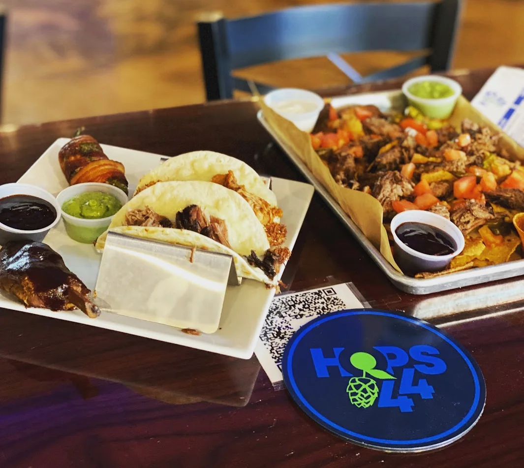 Platter of Texas-style brisket tacos and loaded nachos