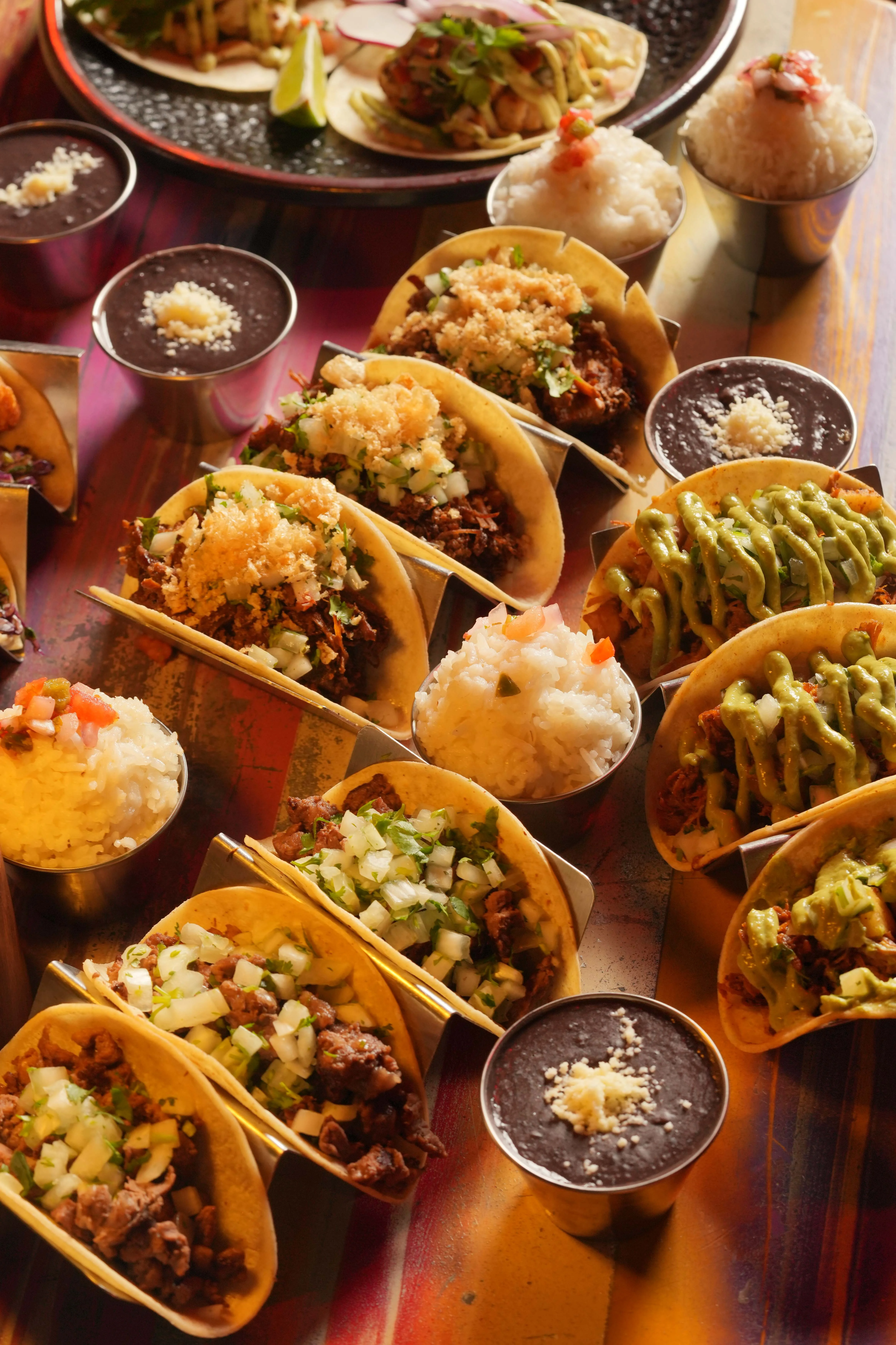Assorted Mexican tacos with rice and beans