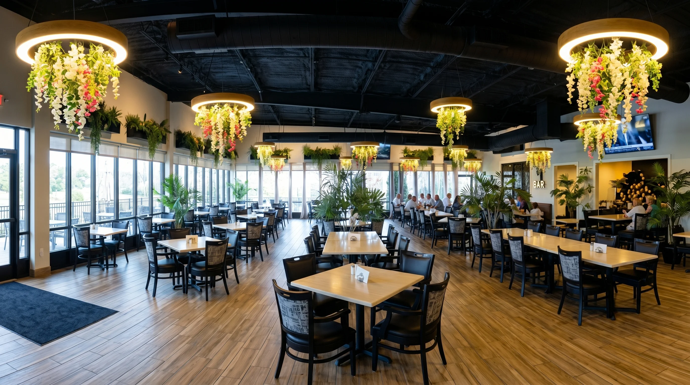 Modern restaurant interior with floral decor and ample seating