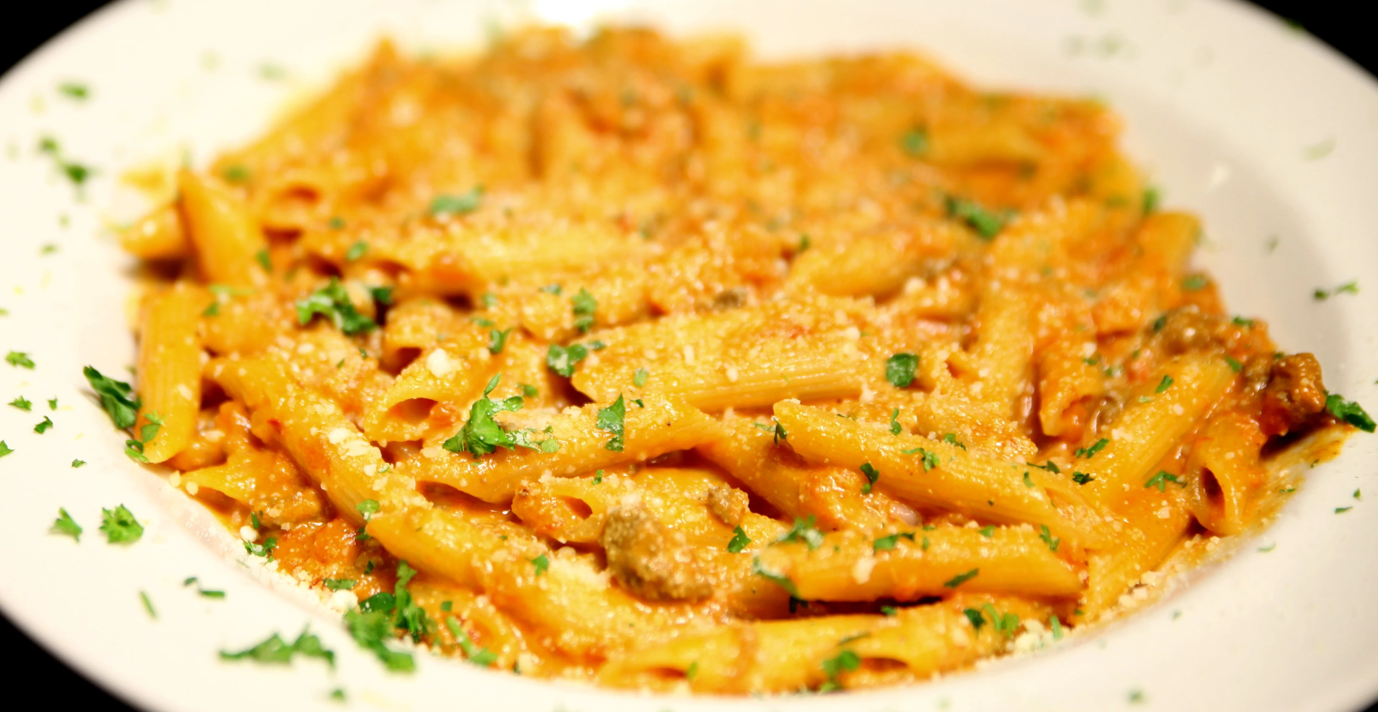Creamy penne pasta in a rich tomato sauce
