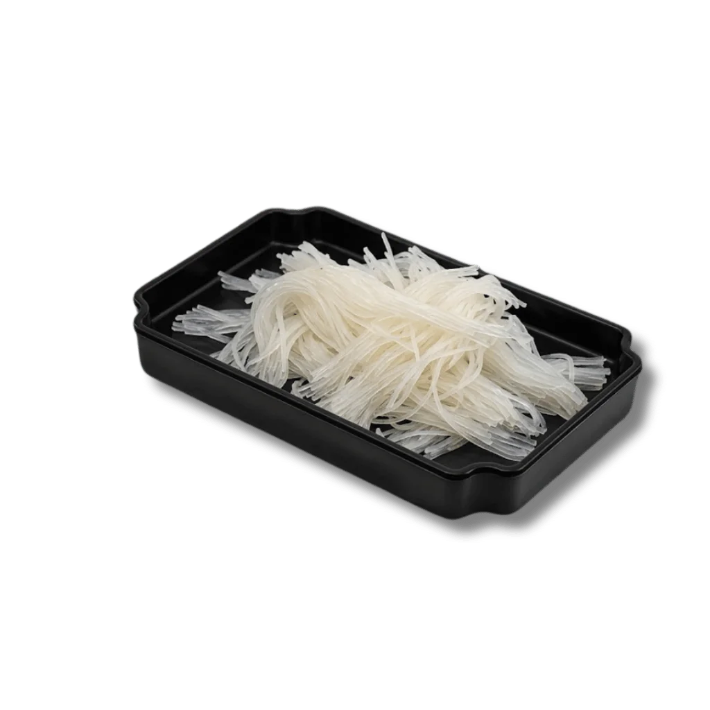 A black tray filled with thin, translucent rice noodles.