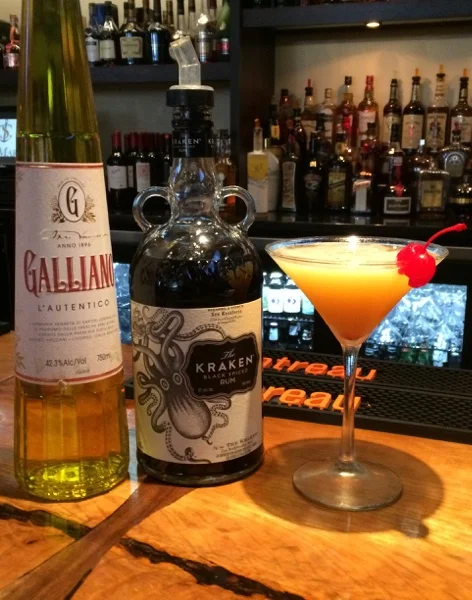 Colorful cocktail with rum and liqueur at a stylish bar