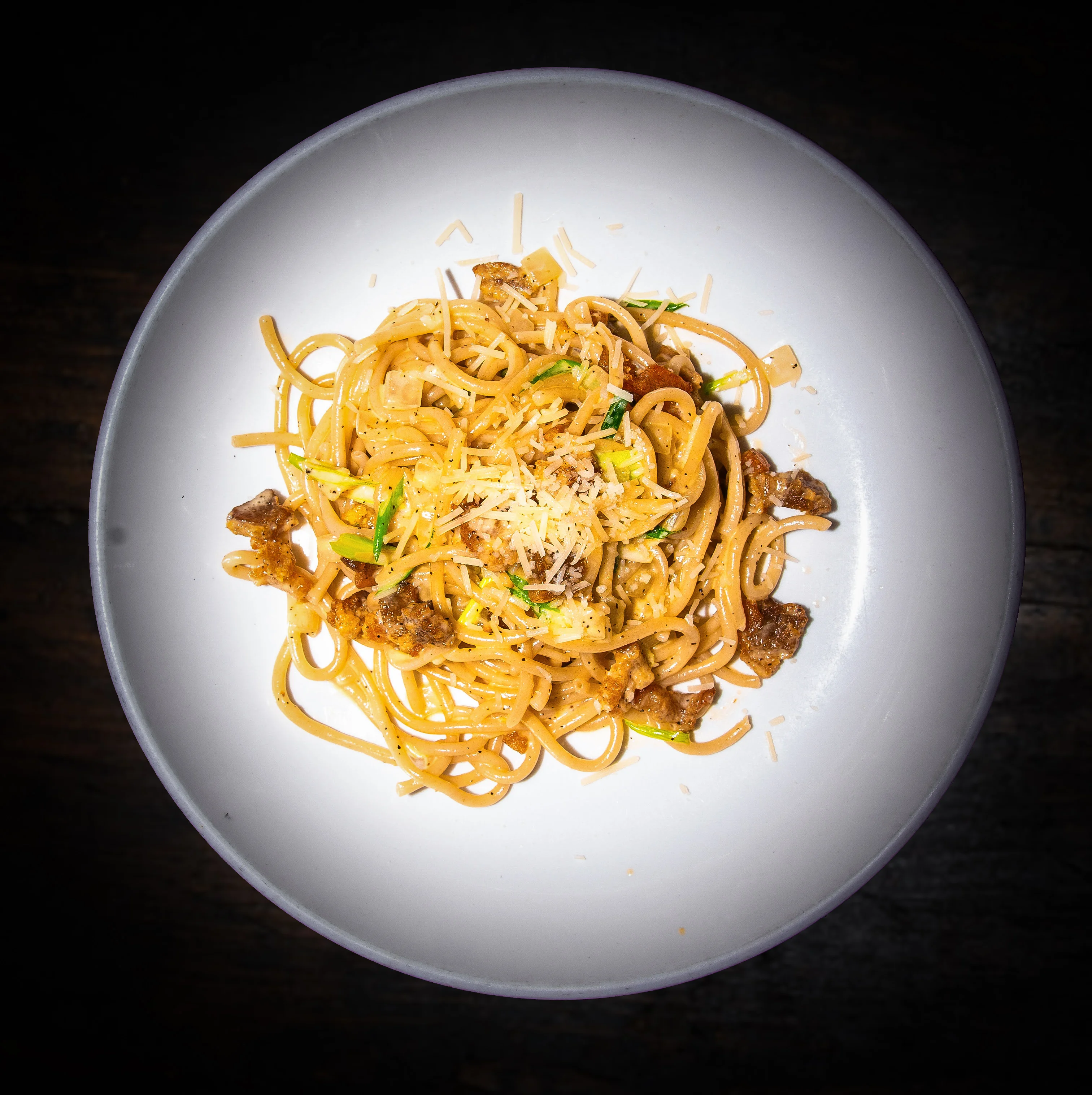 Creamy Italian carbonara pasta topped with cheese