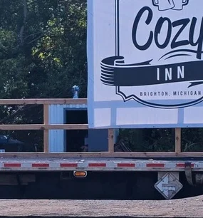 Delicious gourmet burger with fresh toppings on a wooden table