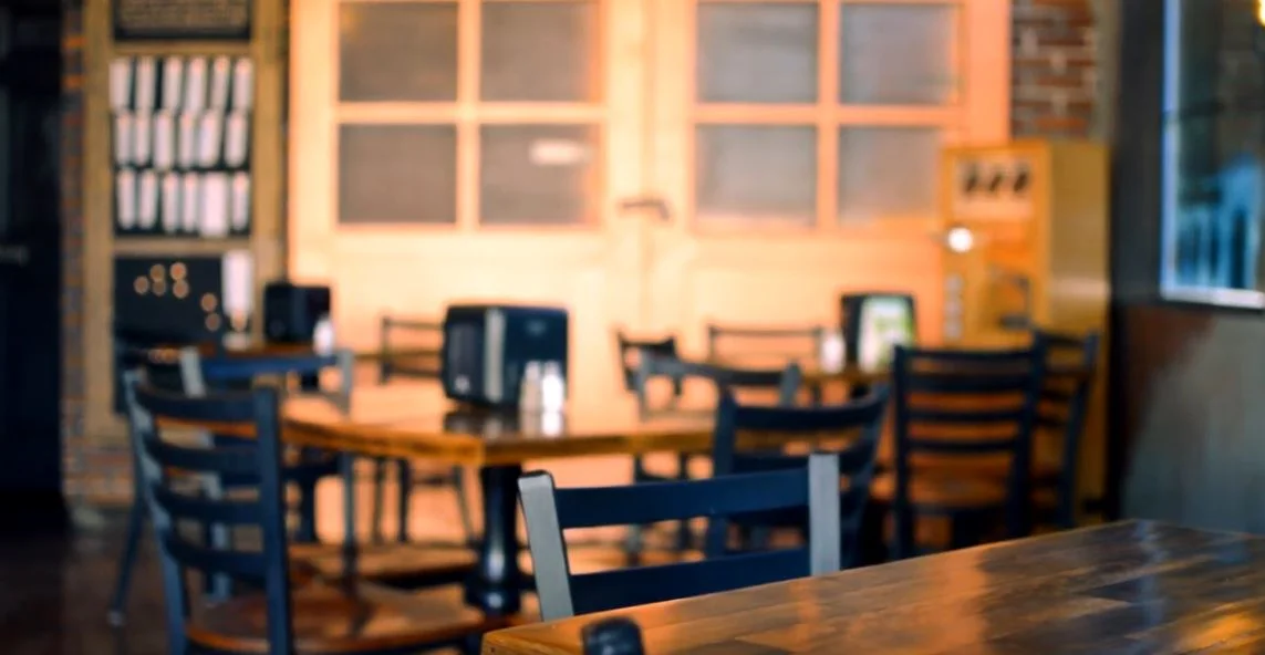 Cozy restaurant interior with wooden tables and chairs