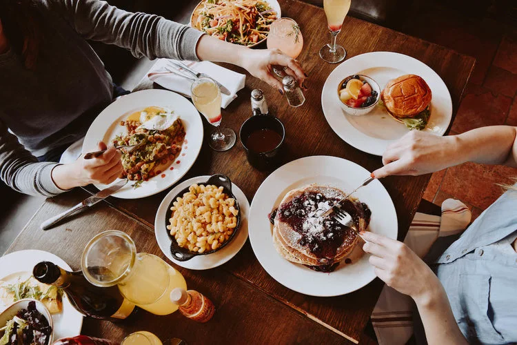 Brunch spread featuring fluffy pancakes and savory dishes