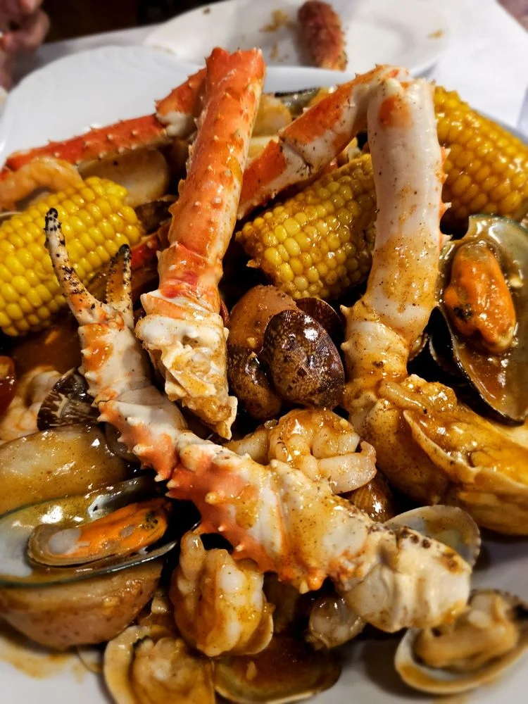 Seafood boil with crab, shrimp, and corn