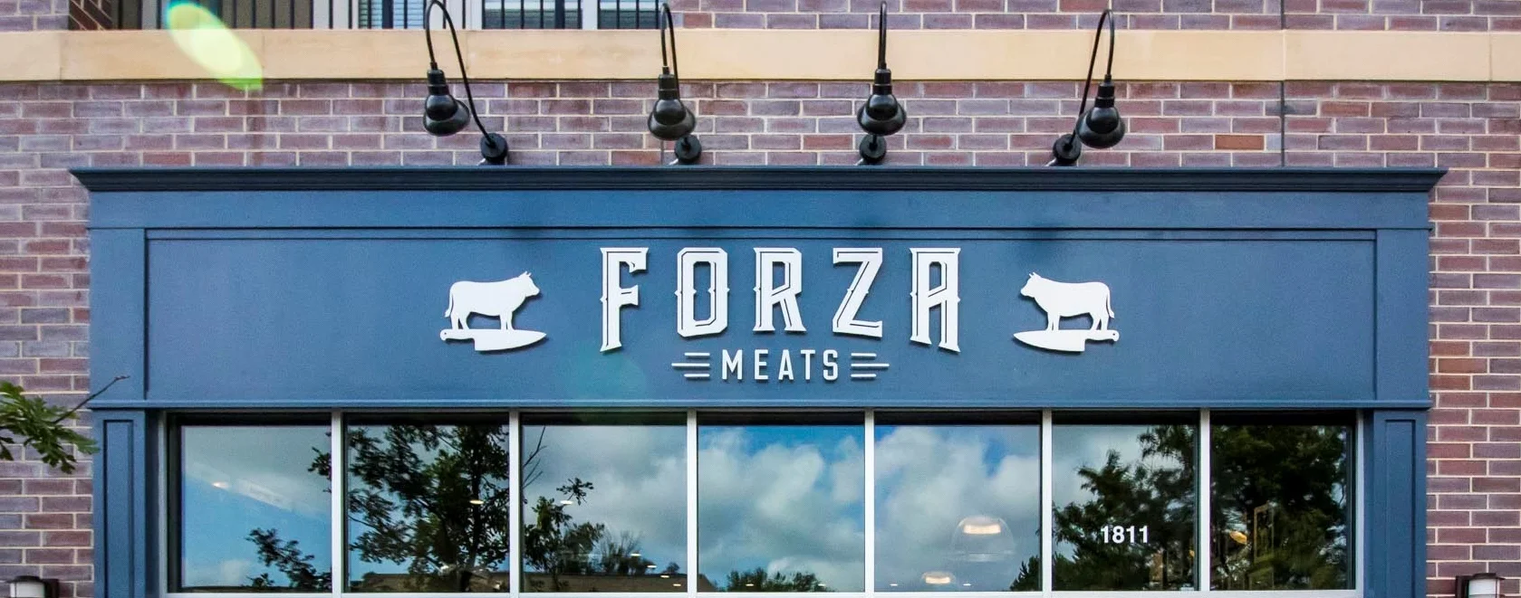 Exterior view of Forza Meats Glenview signage