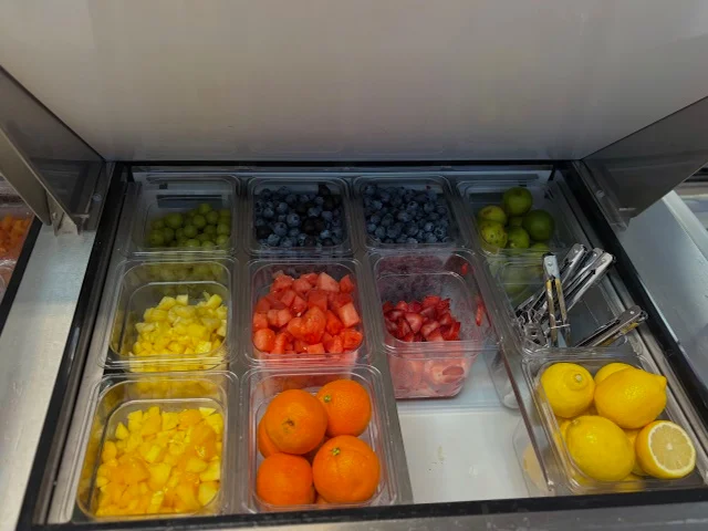 Colorful fruit display in a restaurant cooler