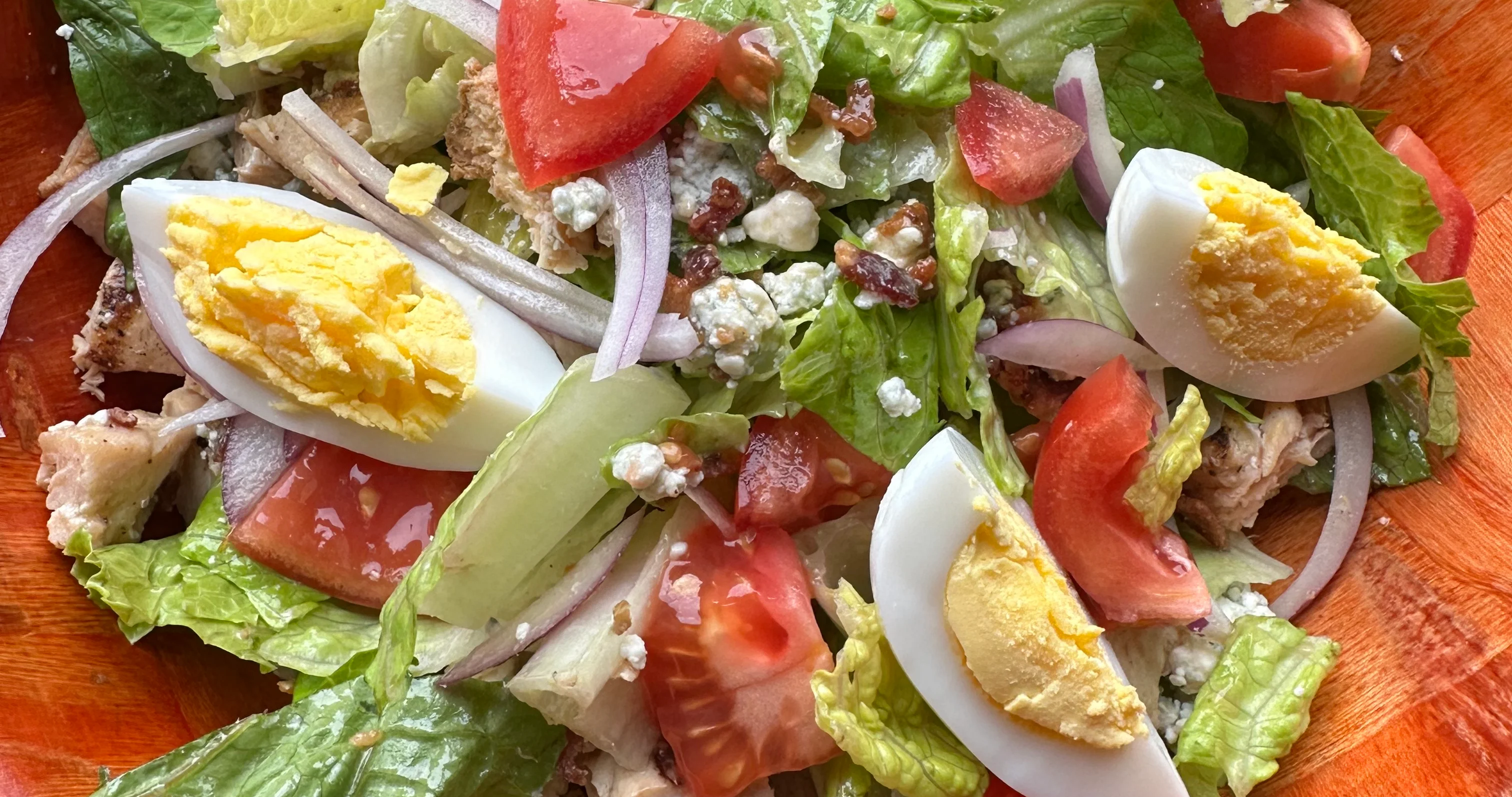 Classic Cobb salad with grilled chicken and hard-boiled eggs