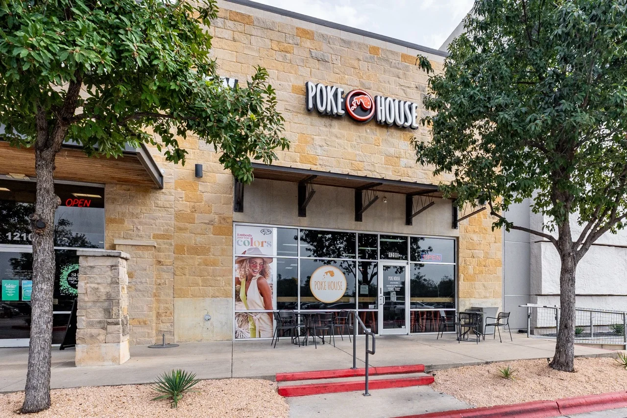 Exterior view of Poke House restaurant with open sign