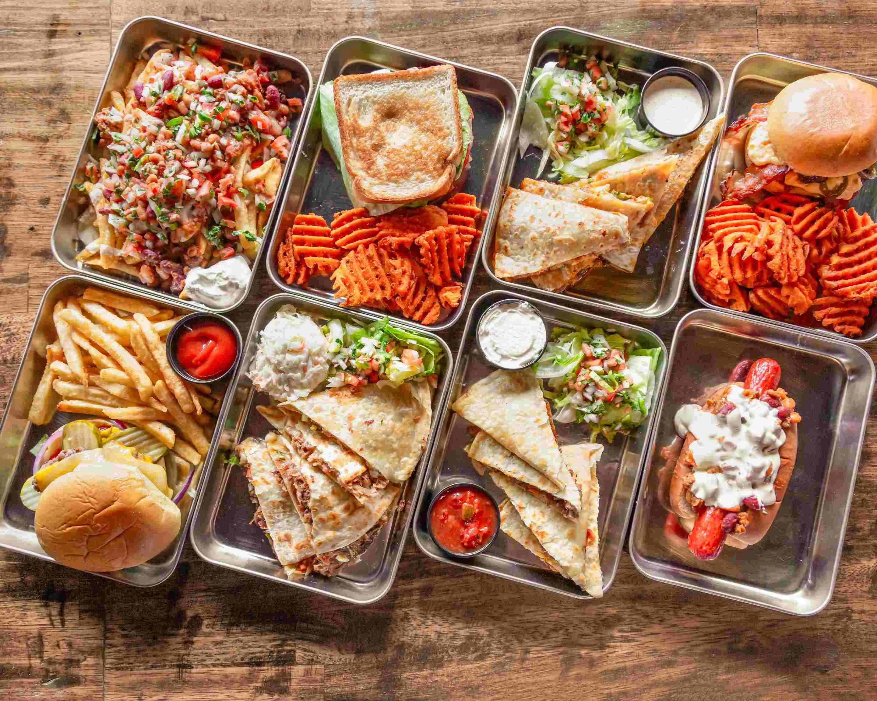Mexican quesadillas with sides of fries and sweet potato fries