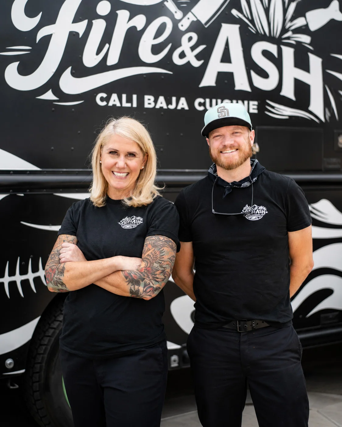 Cali Baja cuisine food truck team smiling in front of their truck