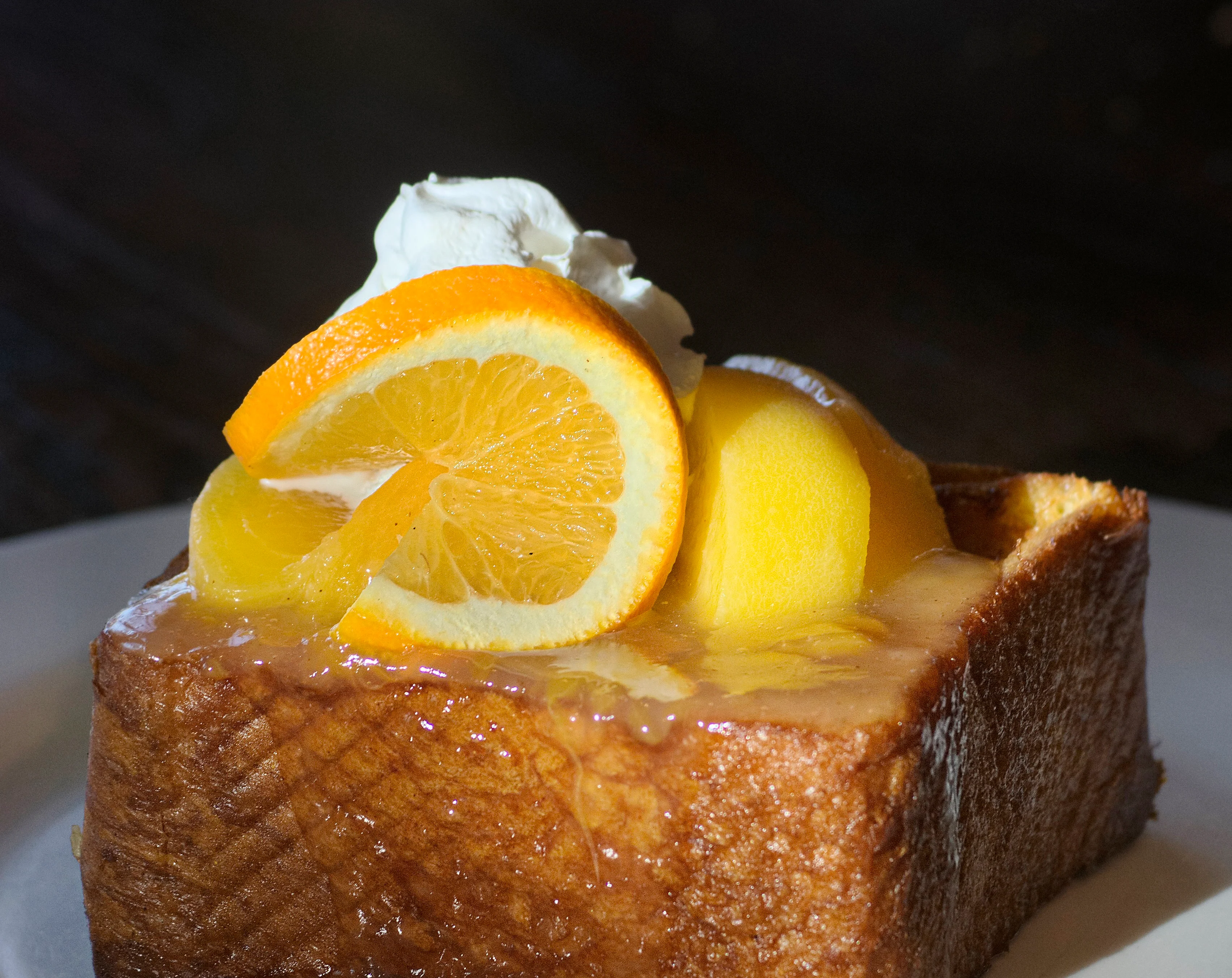 Delicious French toast topped with citrus and whipped cream