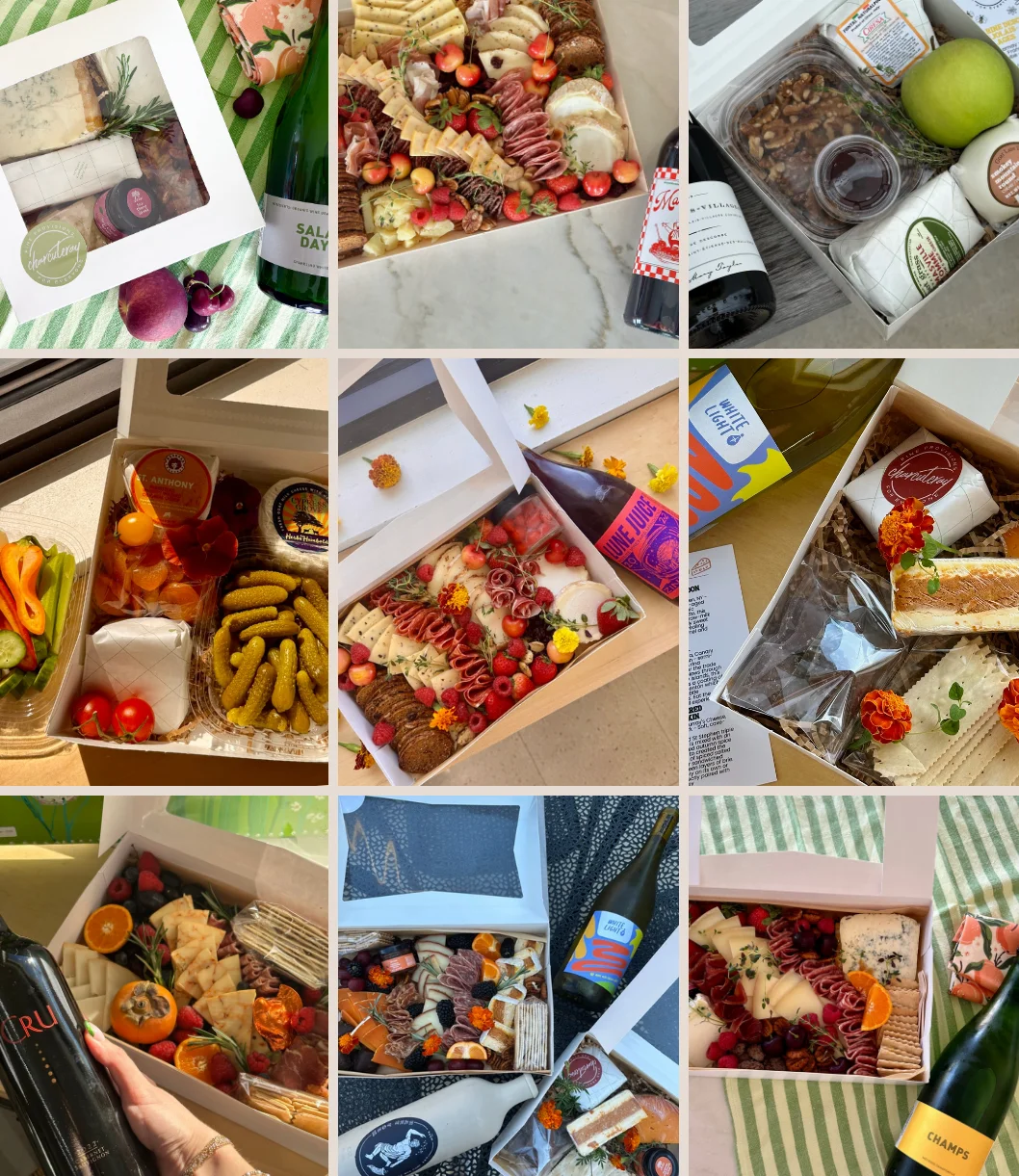 A variety of gourmet charcuterie and cheese boxes with wine.
