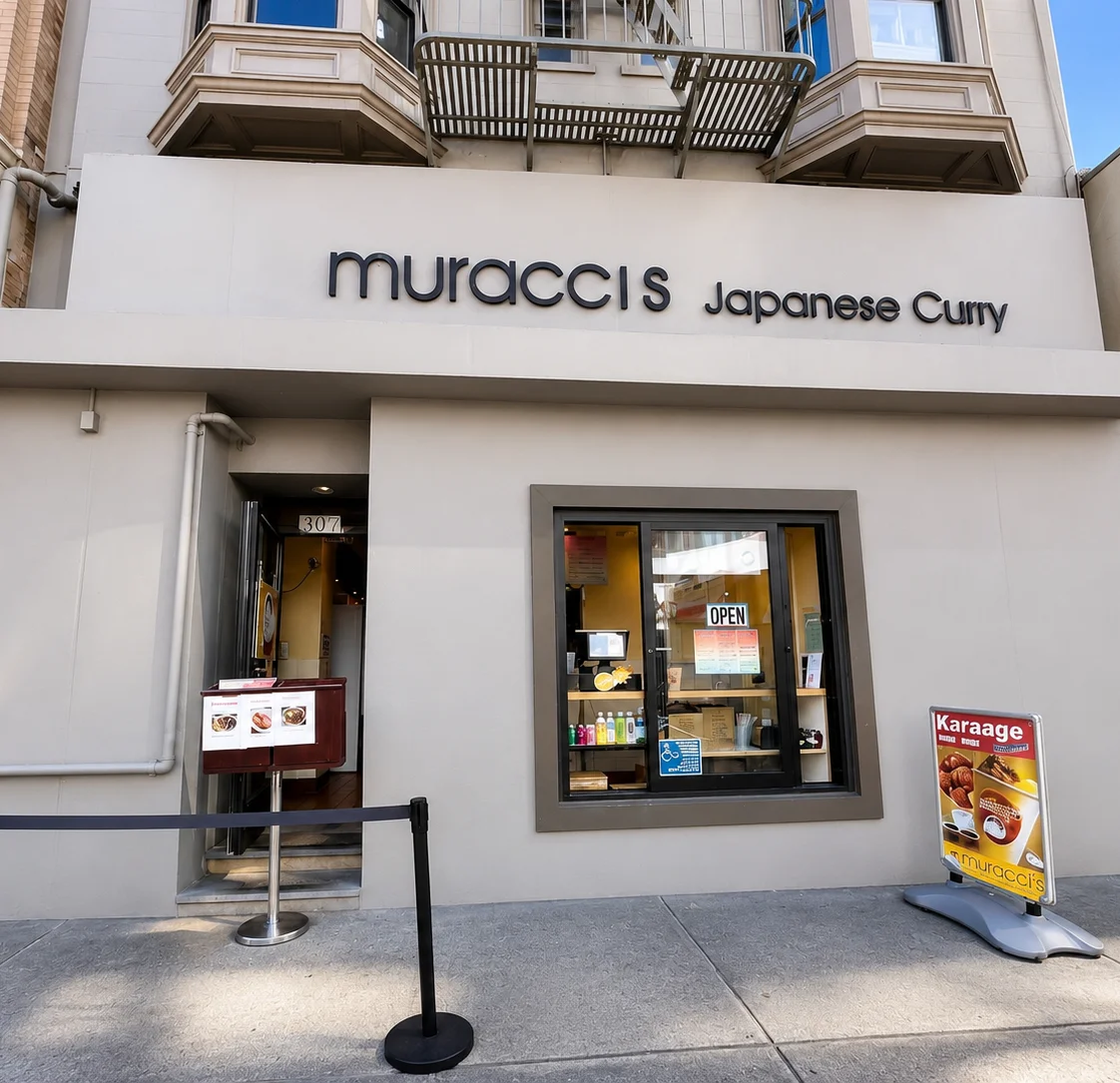 Exterior of Muracci's Japanese Curry restaurant with the main entrance and storefront signage in San Francisco.