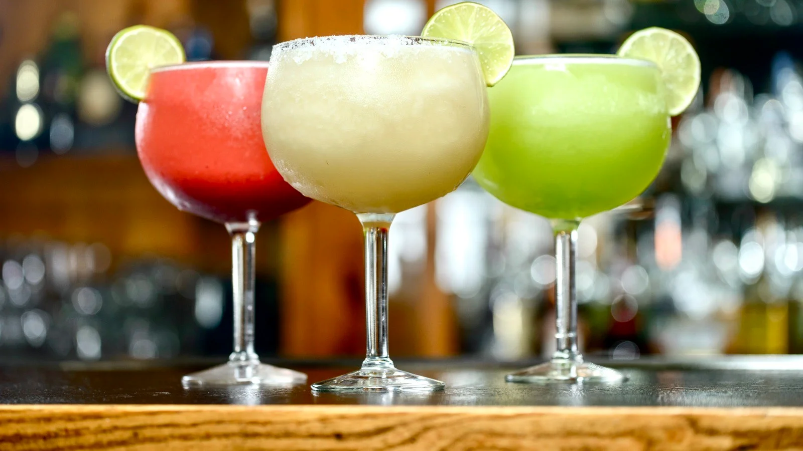 Colorful margaritas in a bar setting
