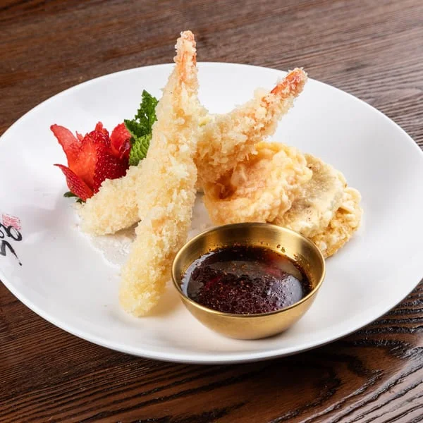 Japanese tempura shrimp with dipping sauce and garnishes