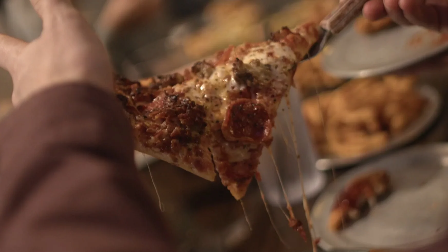 Cheesy pepperoni pizza slice with gooey cheese