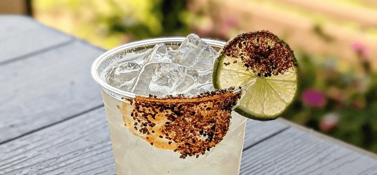 Refreshing Mexican cocktail with lime and chili rim