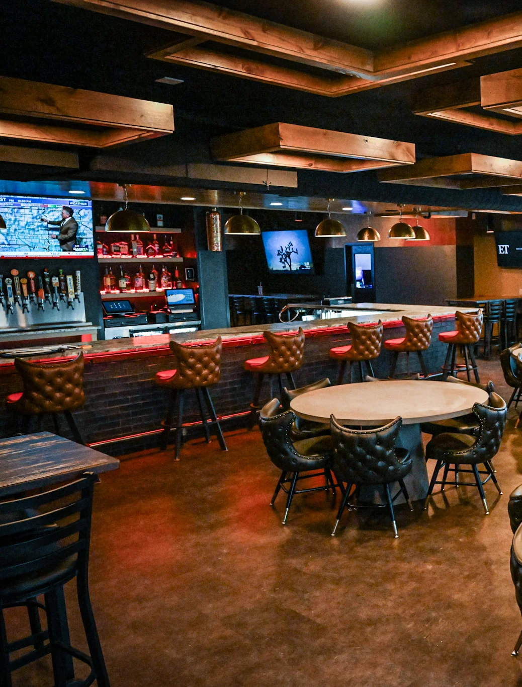 Modern restaurant interior with stylish seating and bar area
