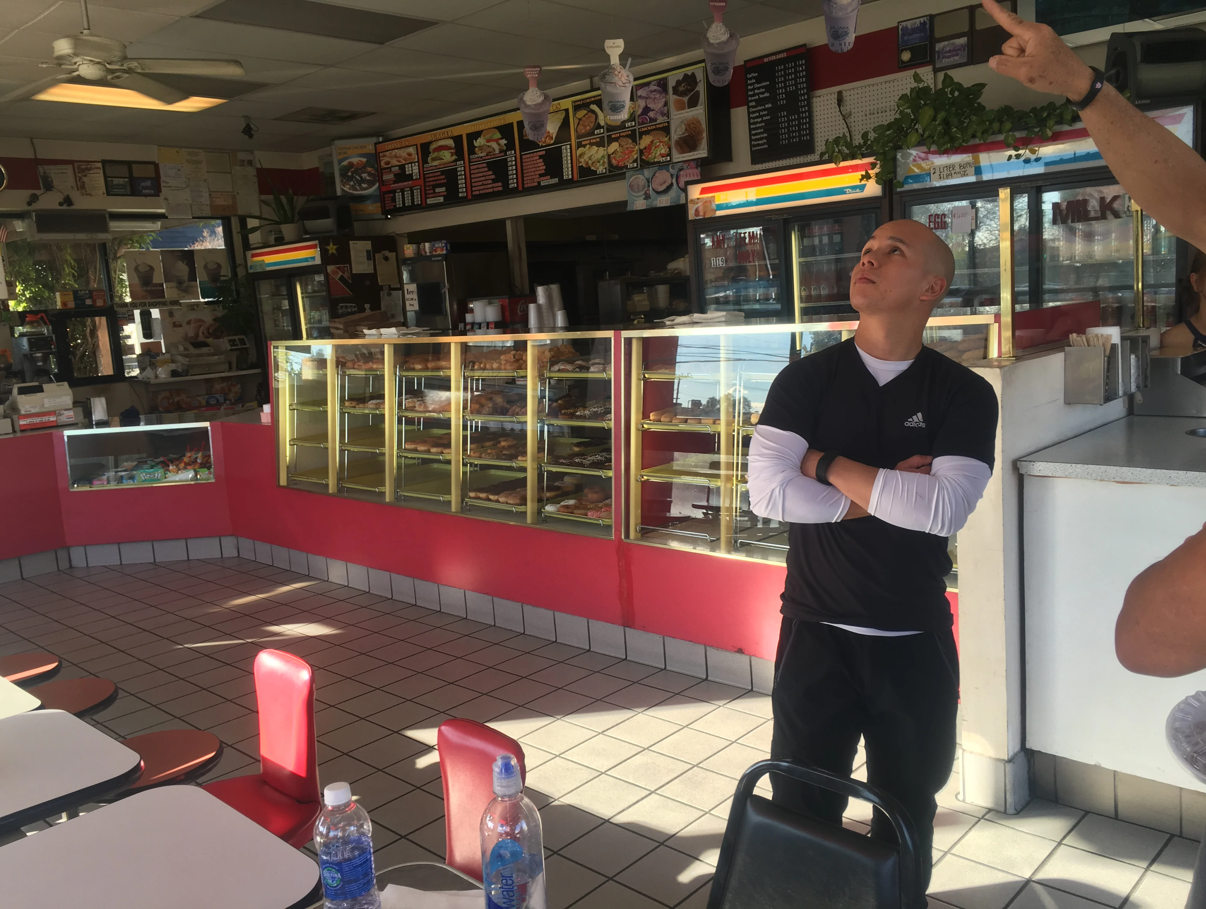 Founder Danny Truong of Painted Dough standing inside their Chino, California storefront