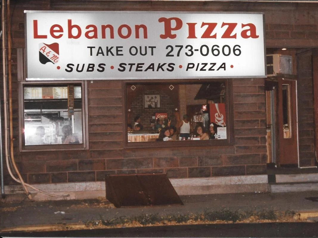 Exterior view of Lebanon Pizza restaurant with takeout sign