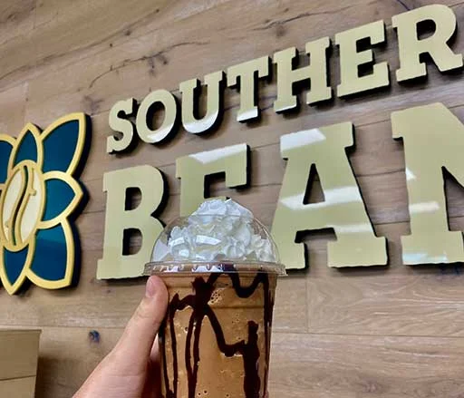 Iced mocha beverage topped with whipped cream