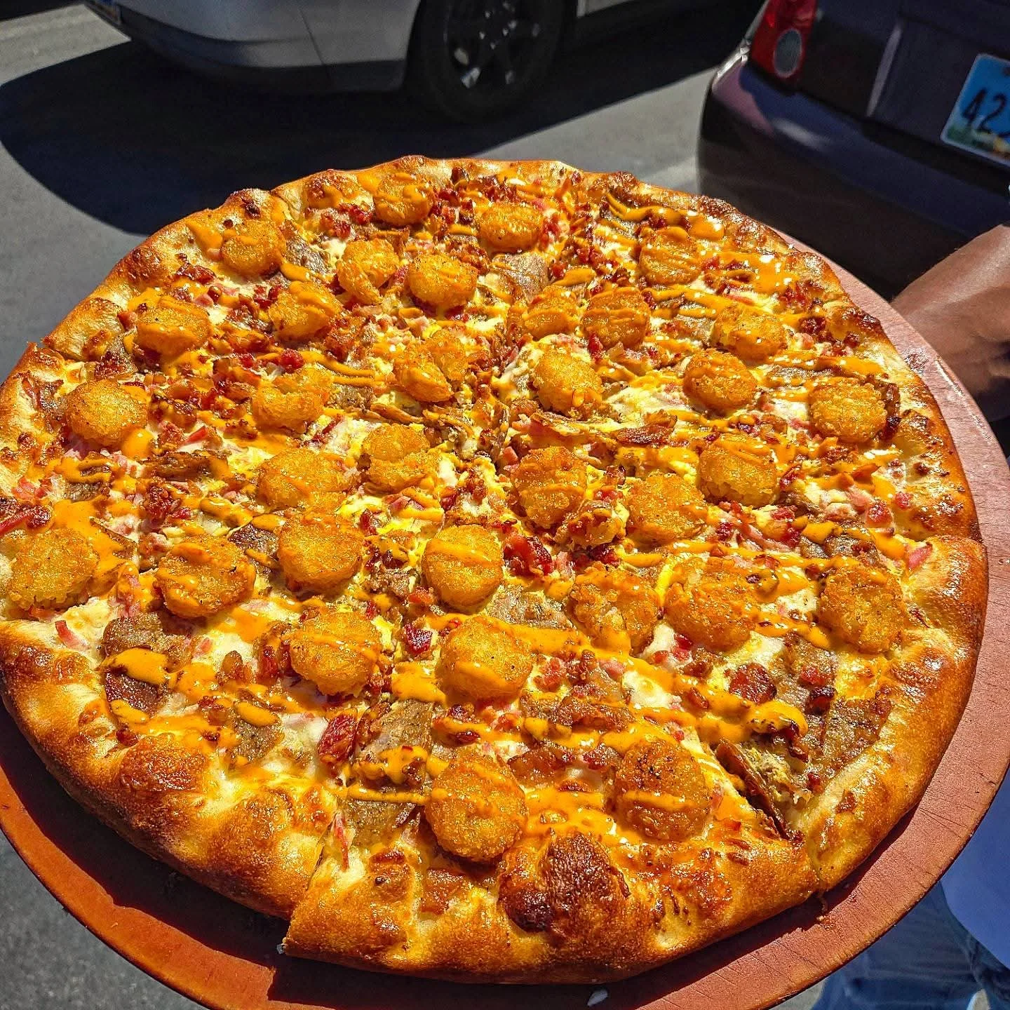 Loaded pizza with shrimp and bacon, a fusion delight