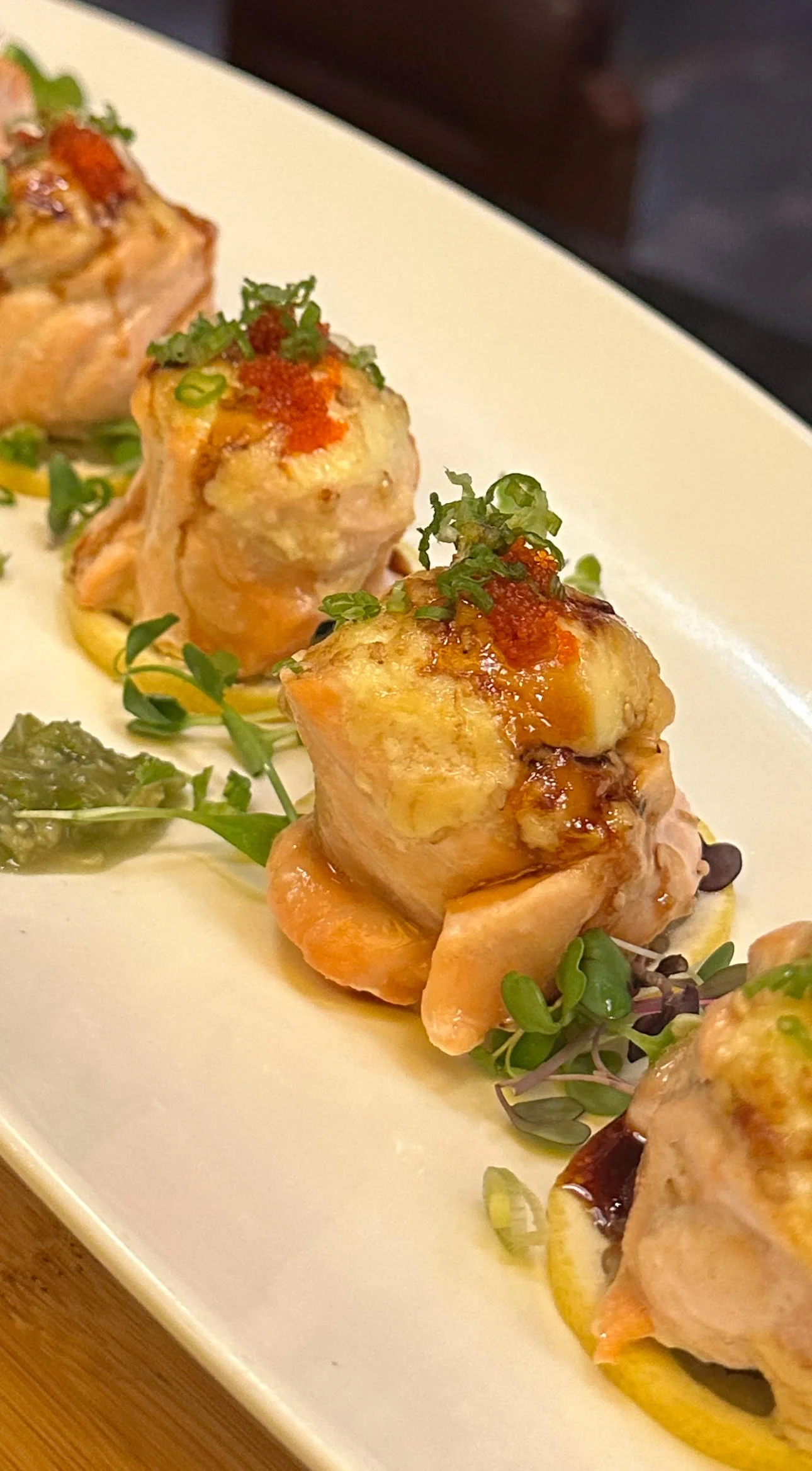 Japanese baked salmon sushi rolls with toppings