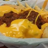Cheesy chili fries topped with melted cheese