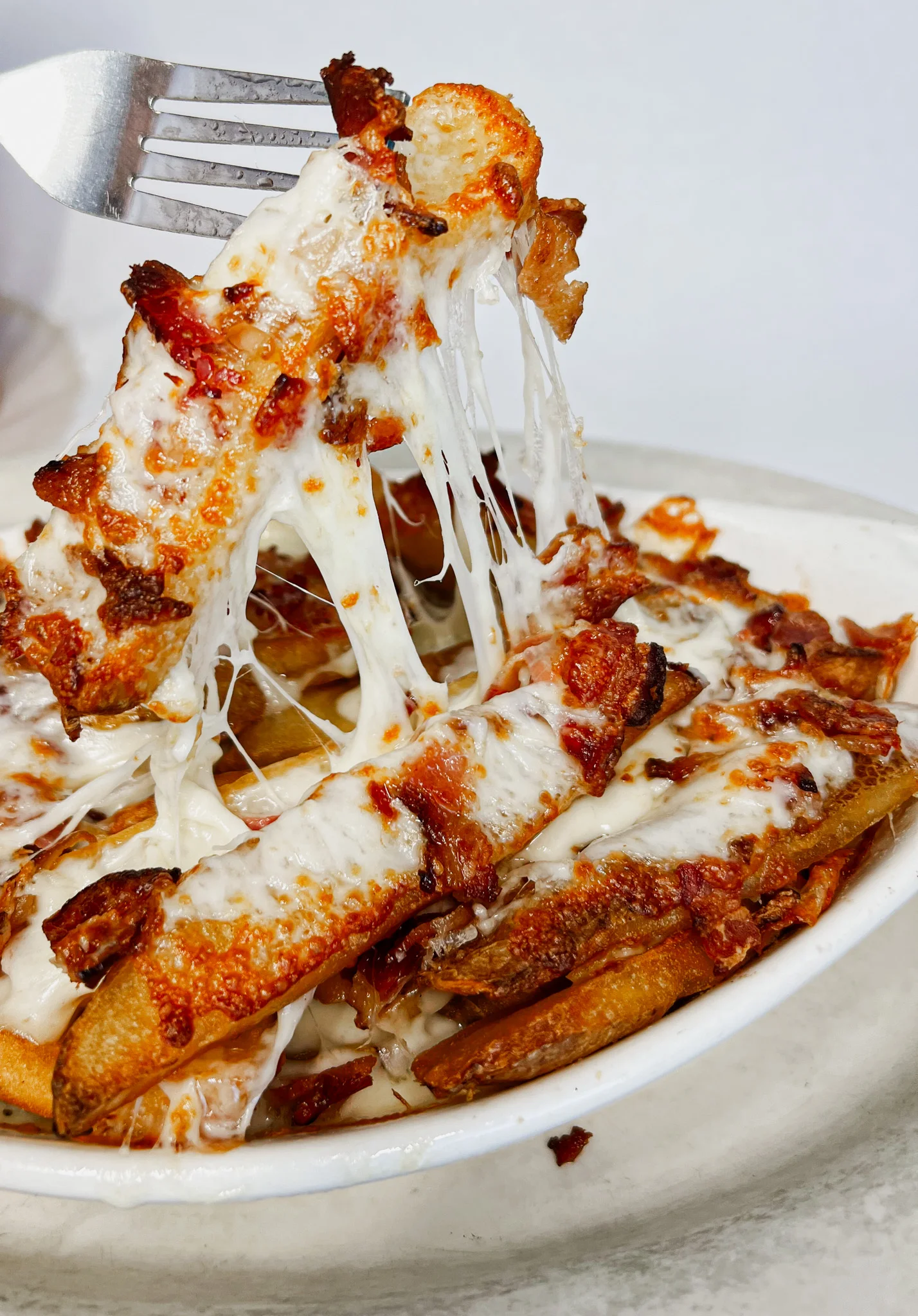 Cheesy loaded fries topped with crispy bacon