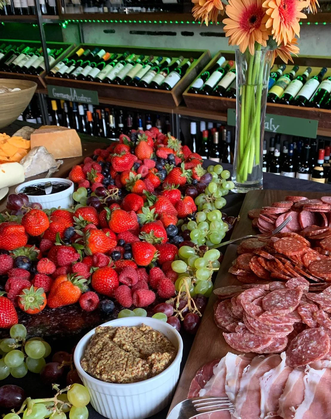 Wine tasting event with guests enjoying a presentation at a stylish bar