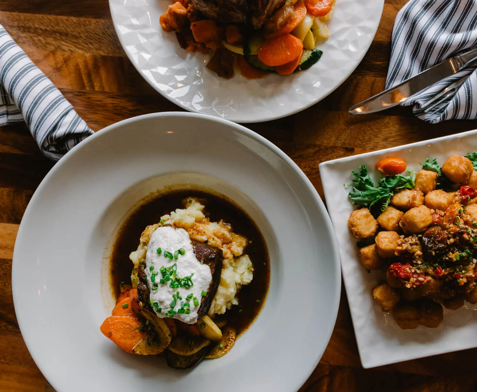 Hearty American pot roast with mashed potatoes and seasonal vegetables