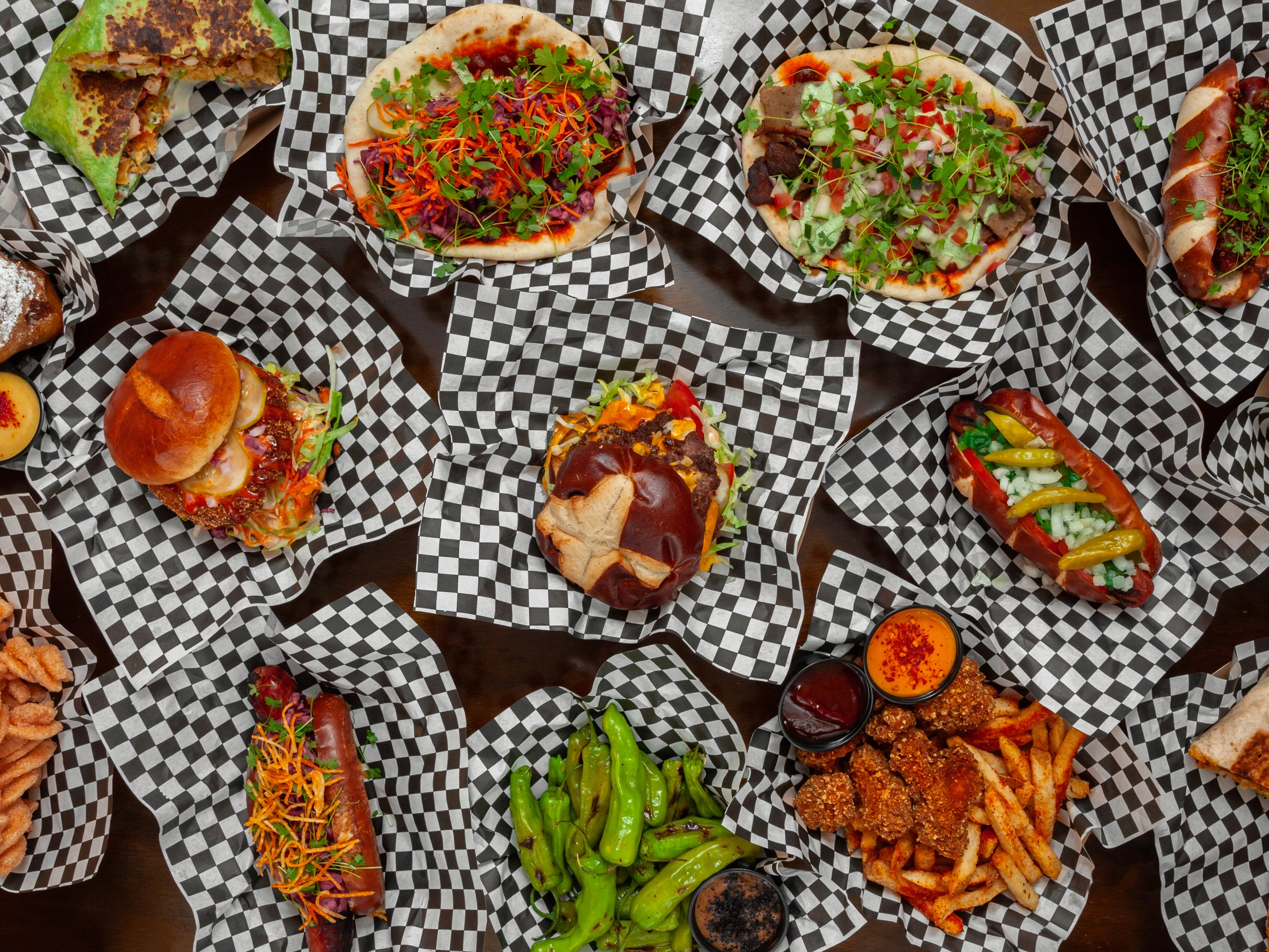 Variety of gourmet street food in paper baskets