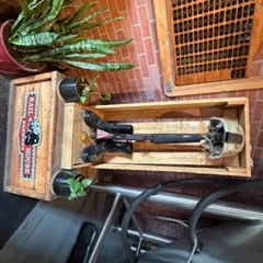 Unique display of vintage firefighter gear in a rustic restaurant setting