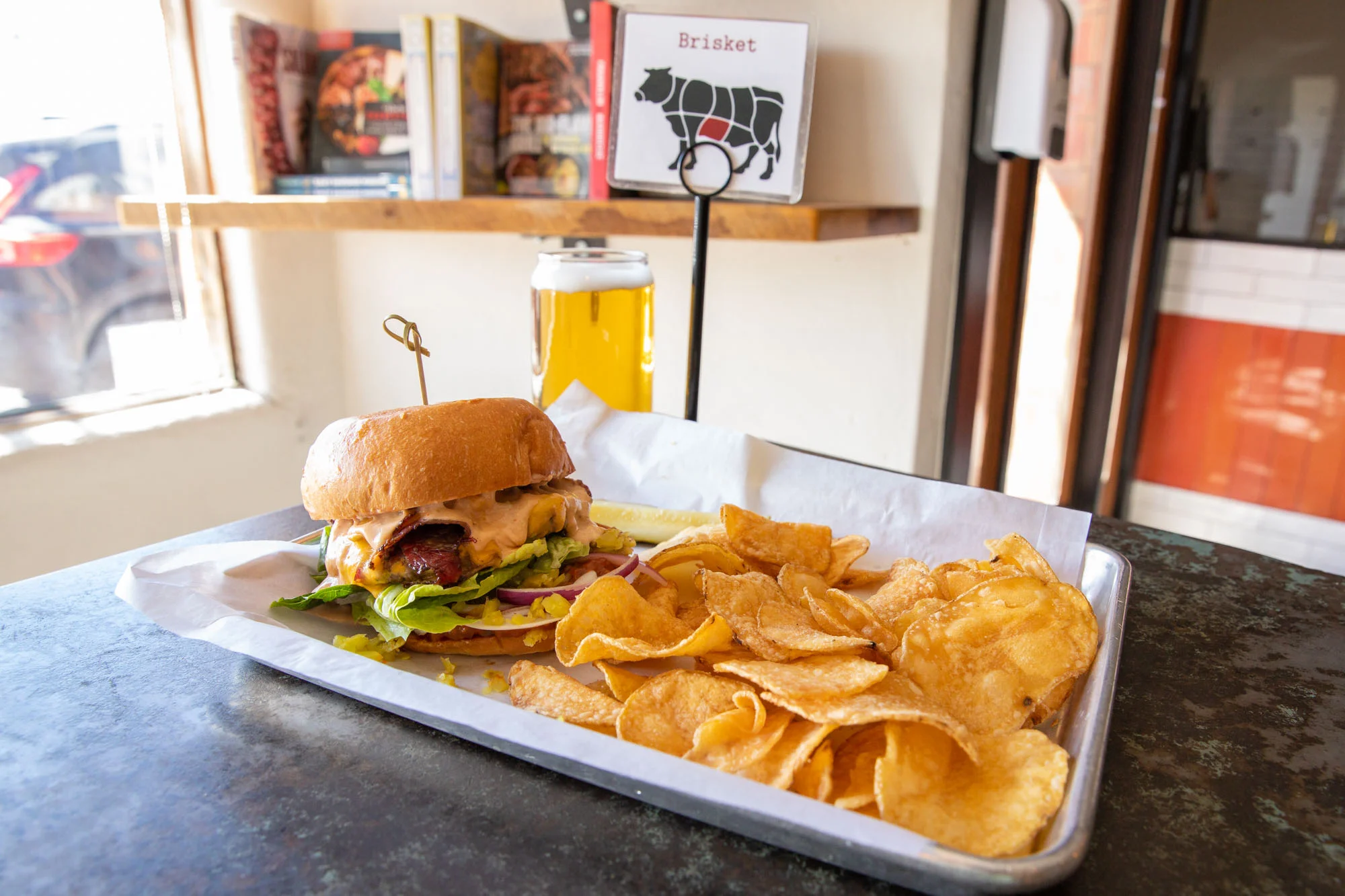 Classic Reuben sandwich with chips and a drink