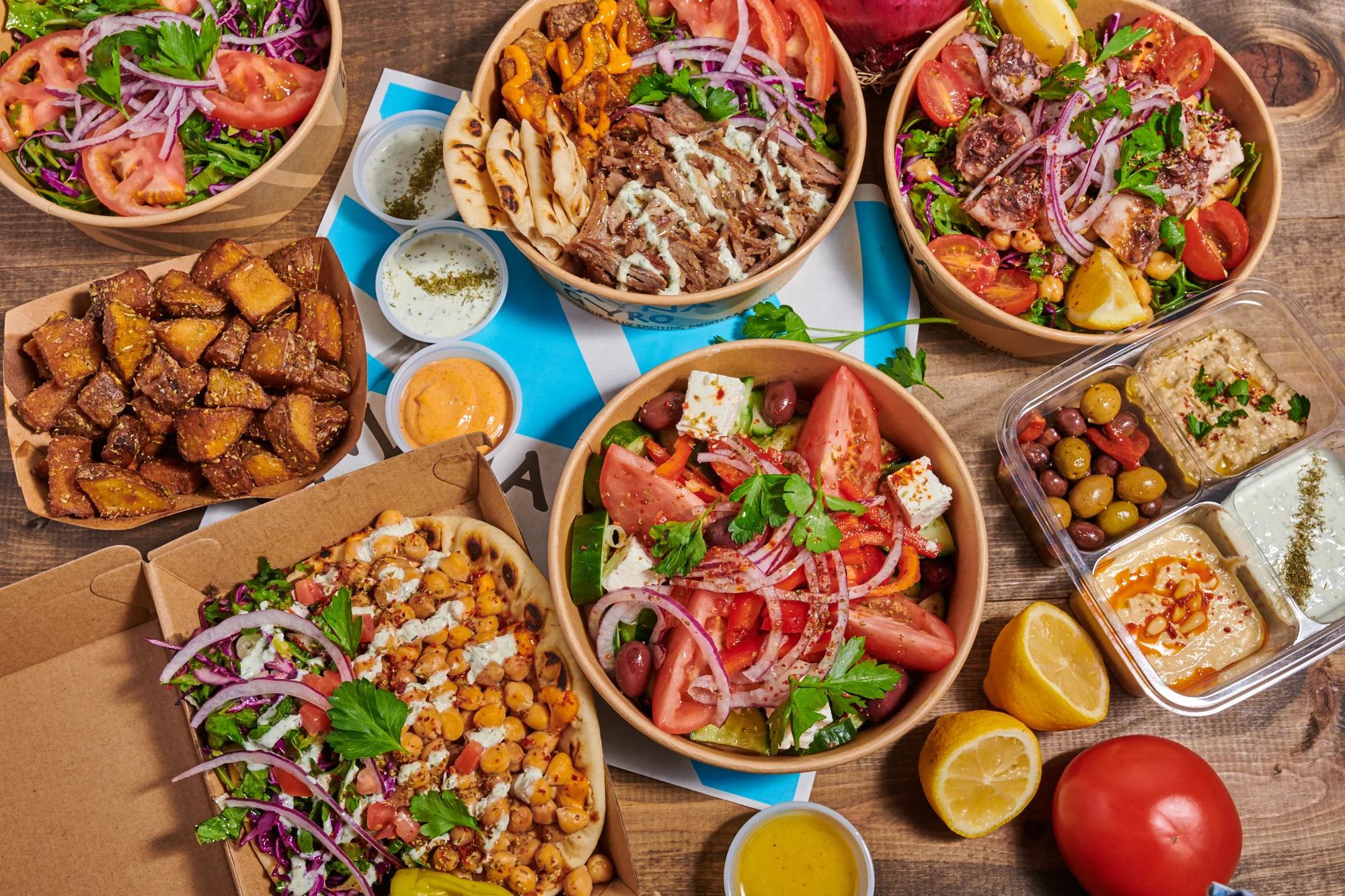 Mediterranean mixed bowls with grilled meats and fresh salads