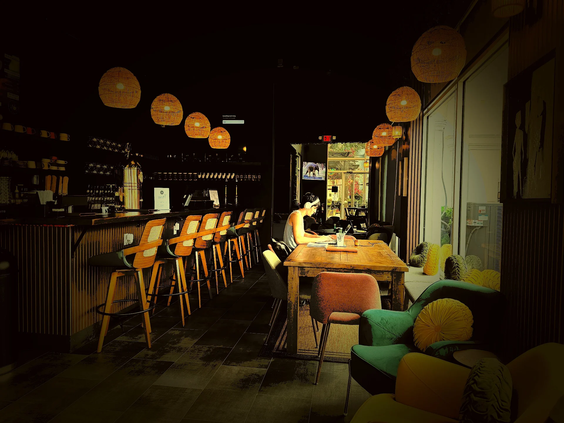 A cozy cafe space with wooden tables and seating. Warm ambient lighting creates a welcoming environment for patrons.