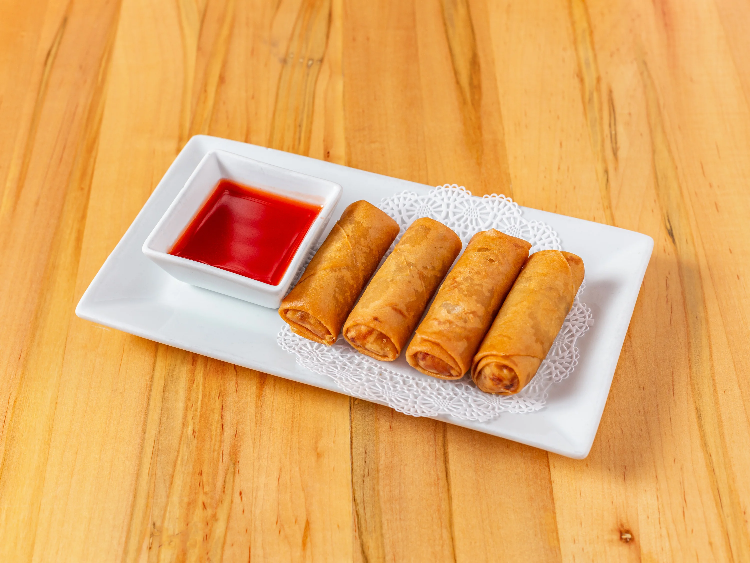 Crispy Vietnamese spring rolls with sweet chili sauce