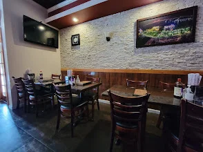 Cozy restaurant interior with wooden tables and warm lighting