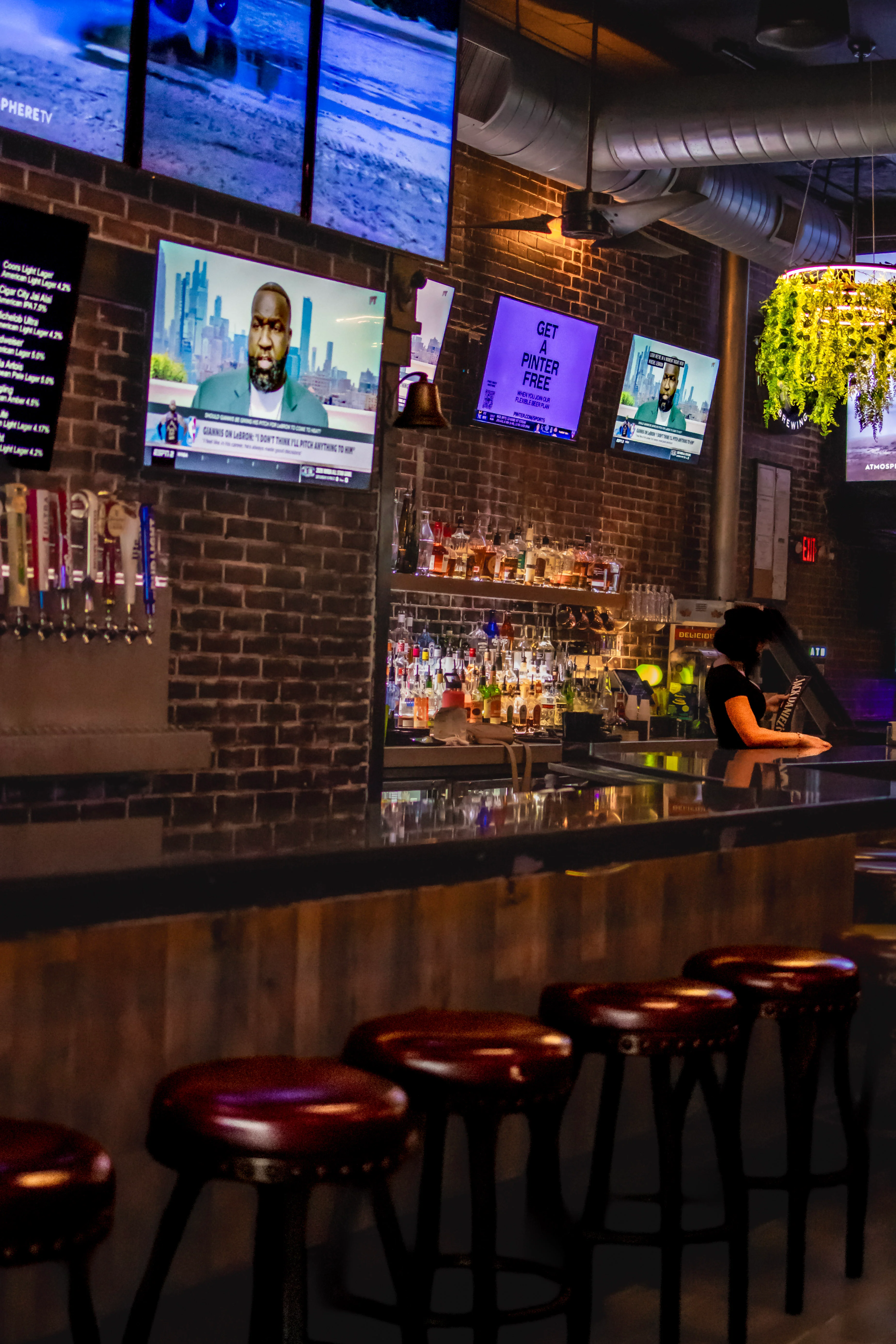 Casual dining scene with friends enjoying drinks at a bar