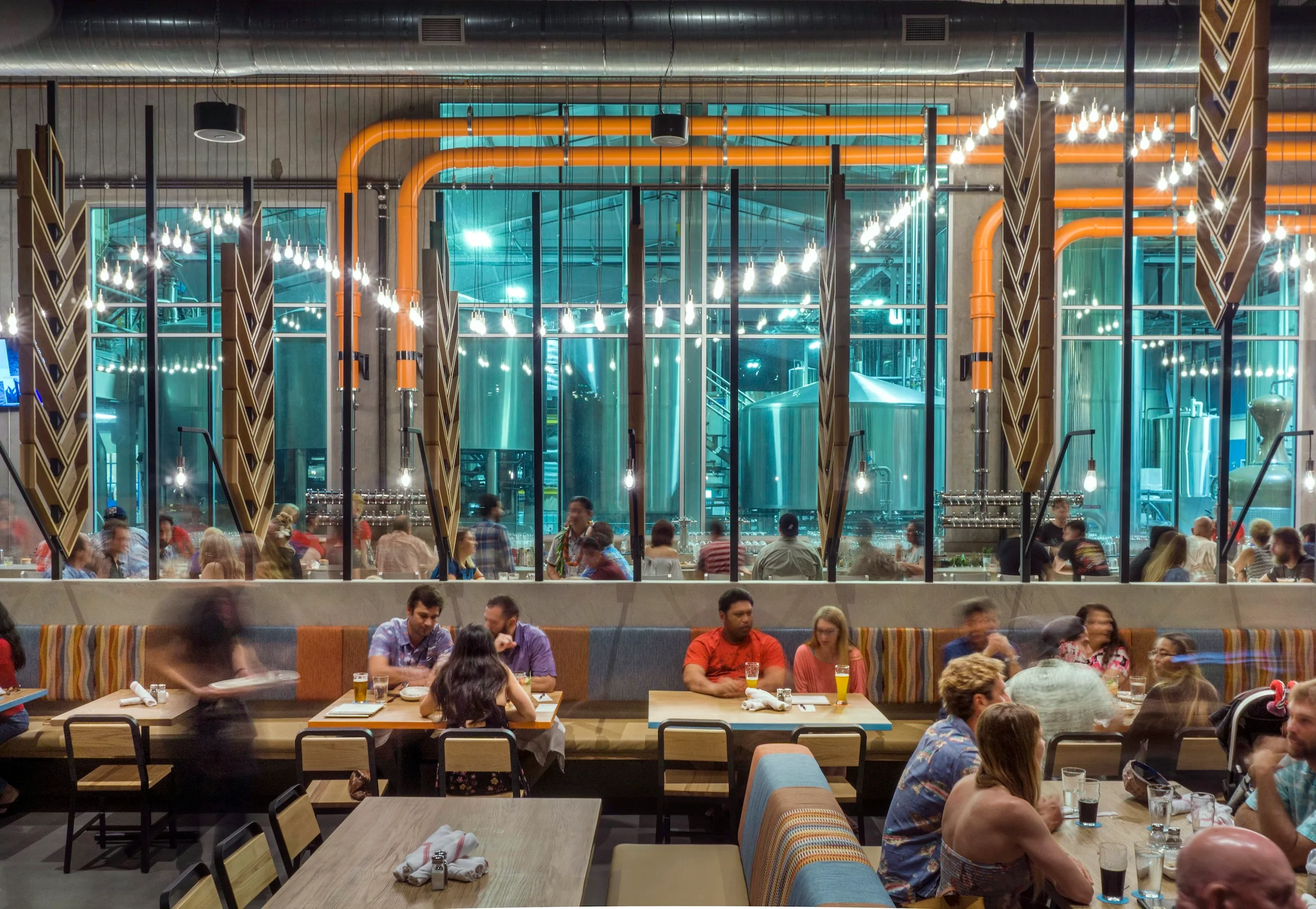 Modern restaurant interior with vibrant decor and lively atmosphere