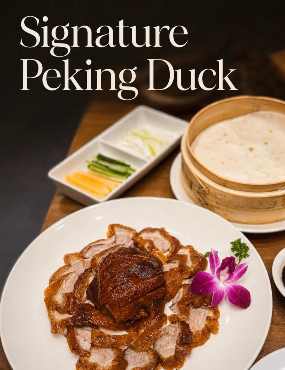 Signature Peking Duck served with pancakes and garnishes