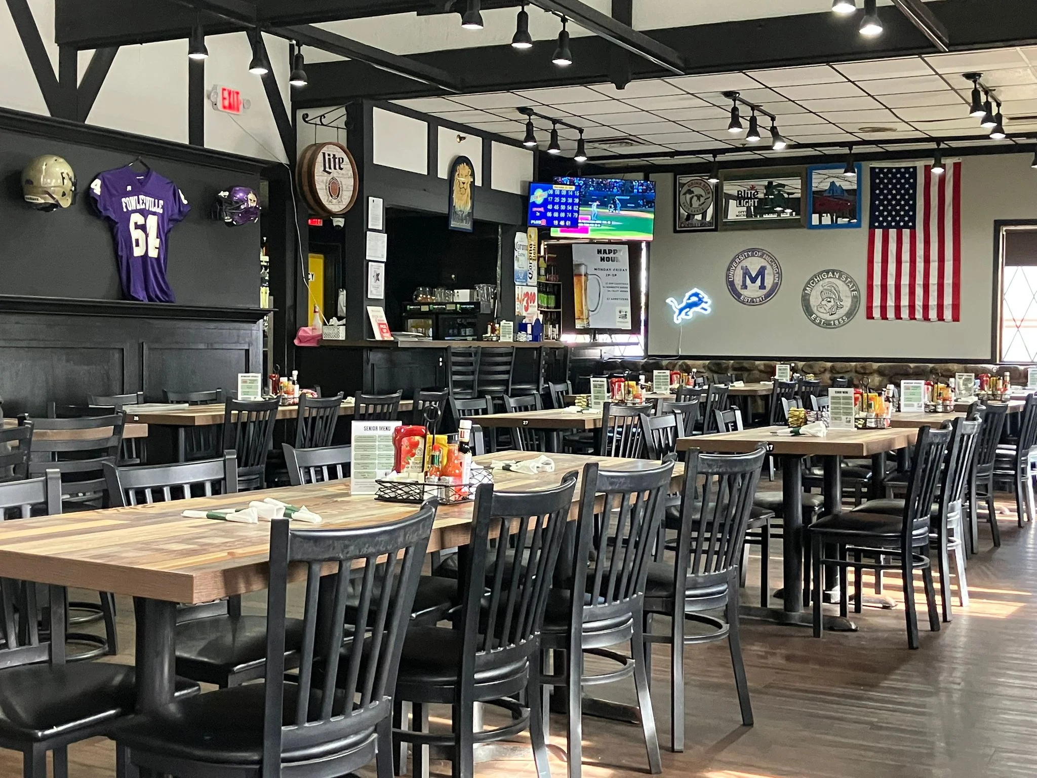 Cozy restaurant interior with sports memorabilia and dining tables