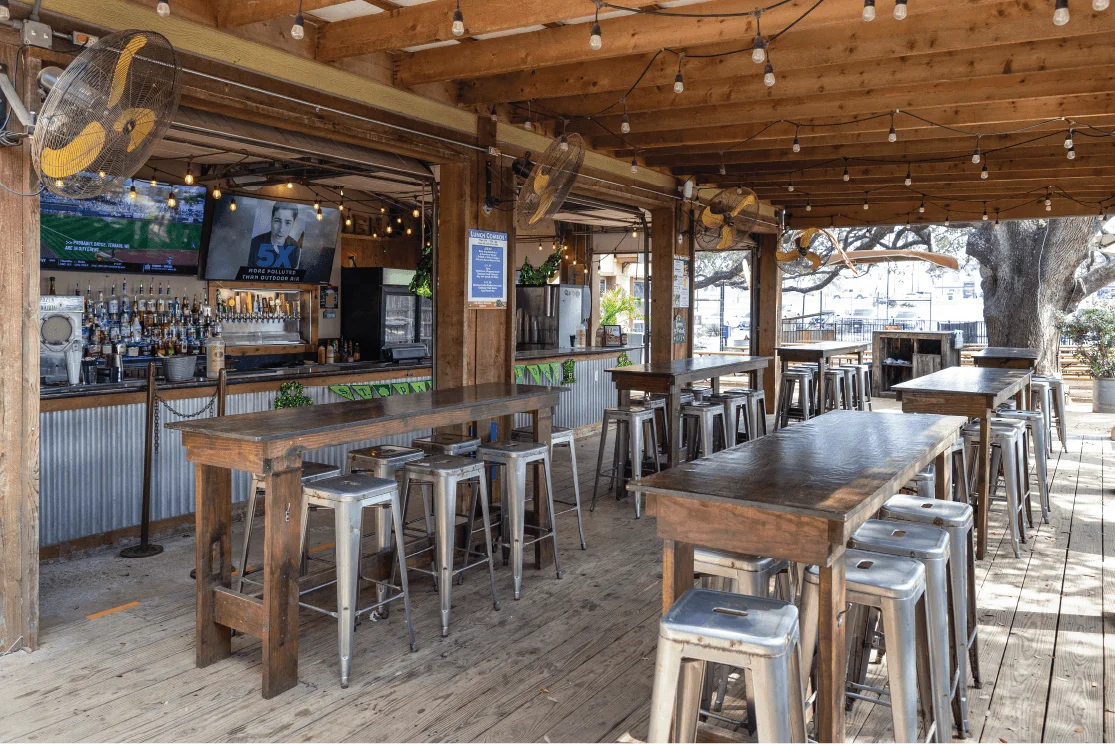 Delicious gourmet burger with fresh toppings on a wooden table