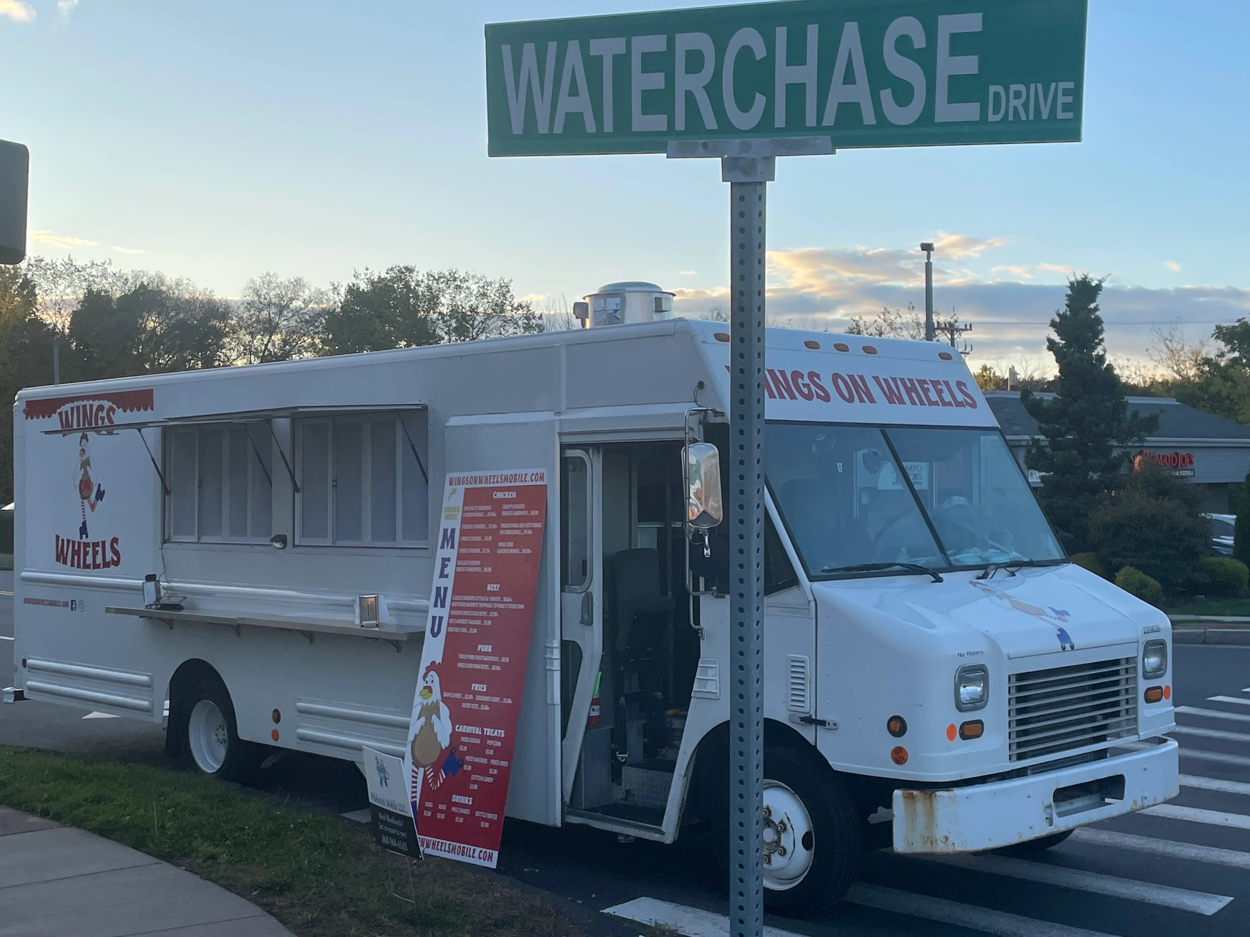 Food truck serving chicken wings on a busy street