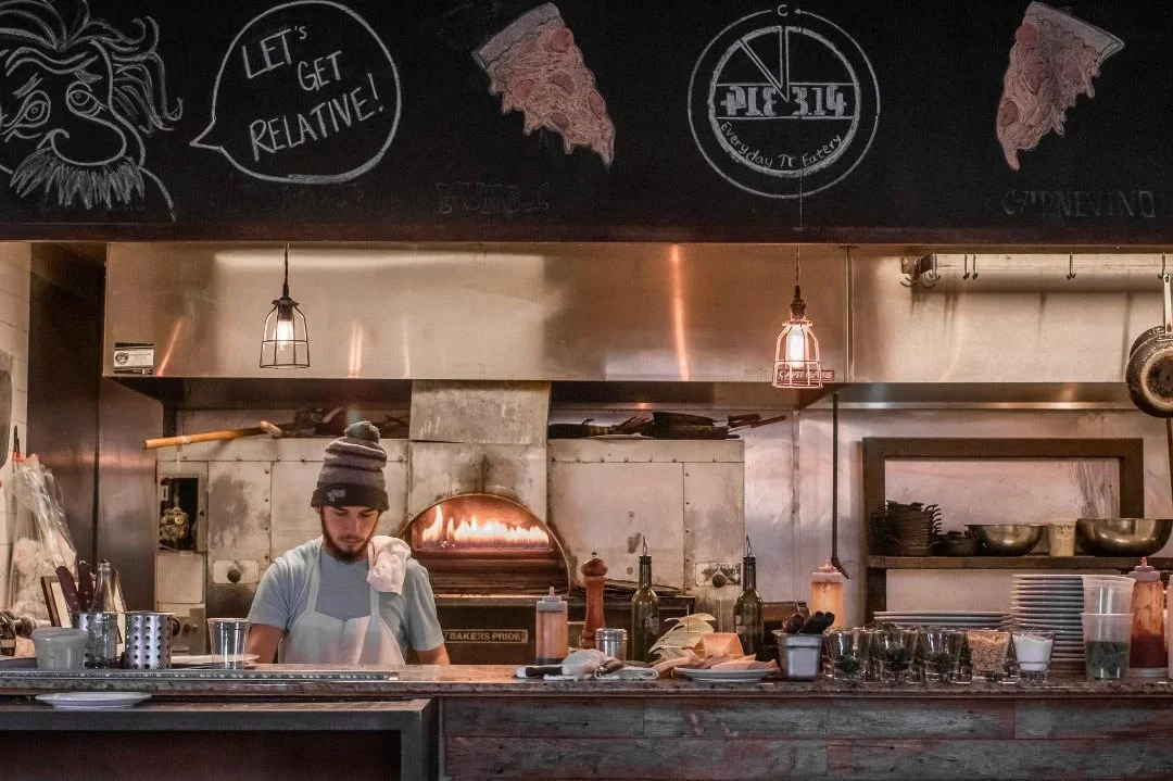 A restaurant chef preparing a dish