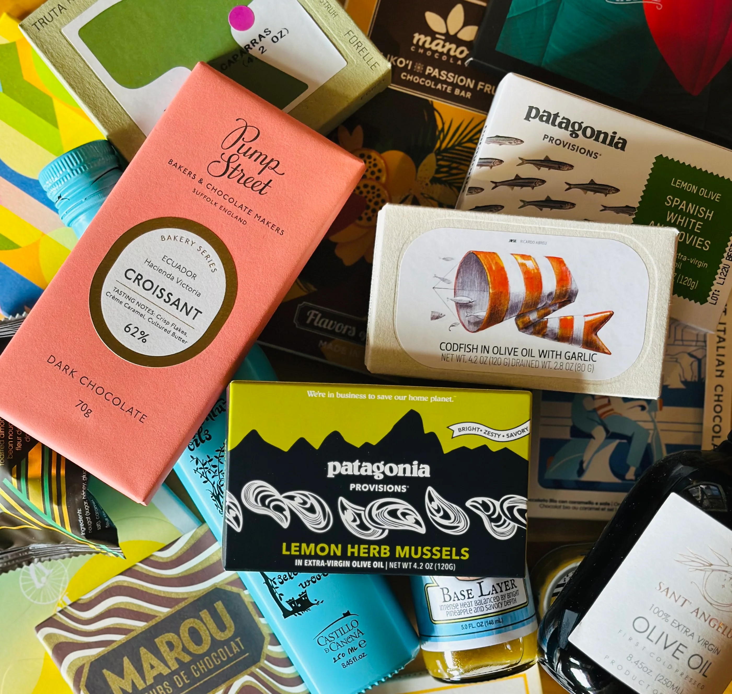 Assorted gourmet food products and chocolates from various brands