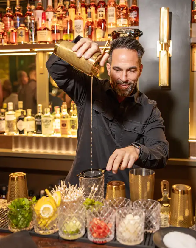 Jason Sims, creating a cocktail